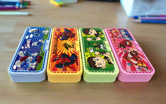 Four colorful pencil cases with cartoon characters on a desk