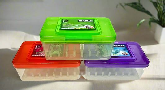Set of three colorful thread boxes lying on a table