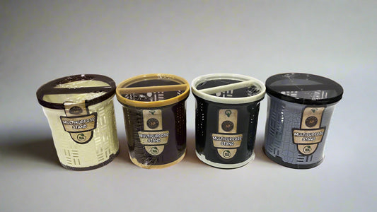 Four cylindrical stands with different color finishes.